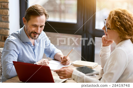 Involved business partners talking in the cafe 28419748