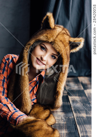 beautiful sexy girl wearing brown fur hat 28420058