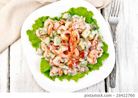 Salad with shrimp and avocado in plate on top Salad with shrimp and avocado in plate on top 28422760
