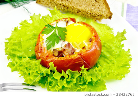 Scrambled eggs in tomato and bread on board 28422765