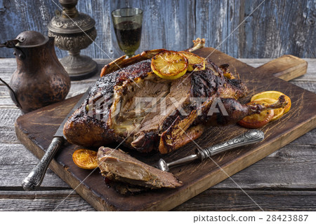 Roast Duck with Orange Slices on Cutting Board Roast Duck with Orange Slices on Cutting Board 28423887