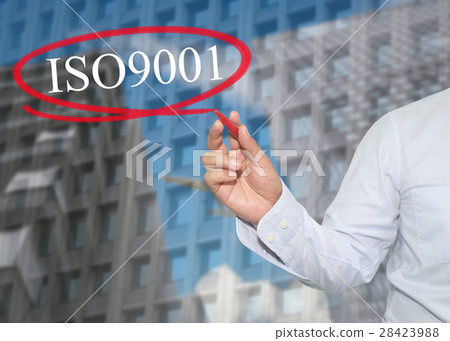 Hand of young businessman write the word ISO 9001 28423988