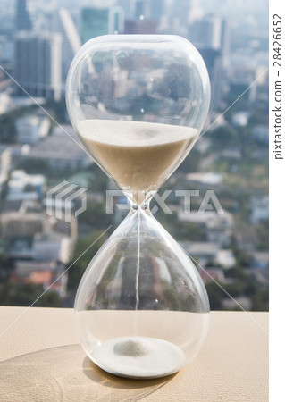 hourglass with cityscape background 28426652