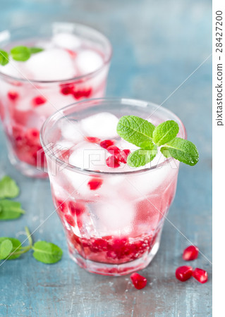 Infused water made of fresh pomegranate with ice Infused water made of fresh pomegranate with ice 28427200