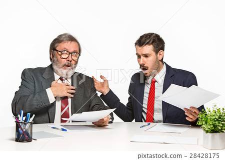 The two colleagues working together at office on The two colleagues working together at office on 28428175
