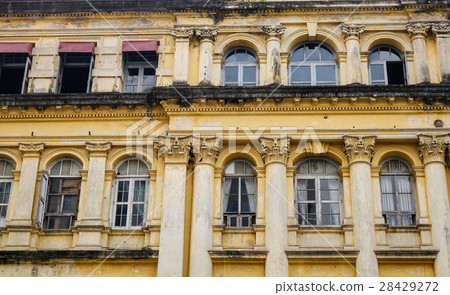Facade of old apartment in Yangon, Myanmar 28429272