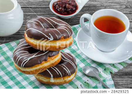 Donuts with Chocolate Icing, a cup of tea 28429325