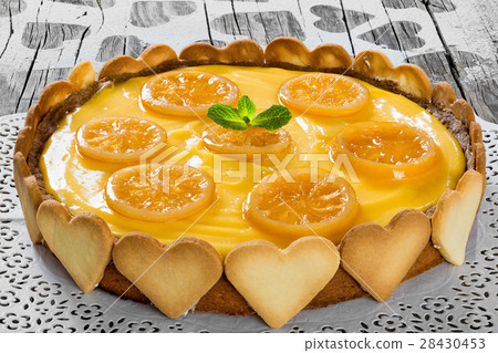 Lemon custard tart, decorated with biscuit 28430453