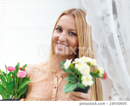Young blond woman in a comfortable terrace Young blond woman in a comfortable terrace 28430695