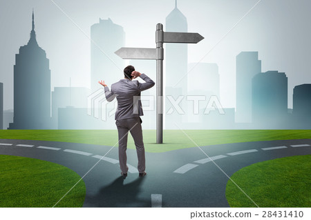 The businessman in difficult choice concept The businessman in difficult choice concept 28431410
