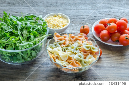 Tricolore farfalle with arugula, parmesan Tricolore farfalle with arugula, parmesan 28431496