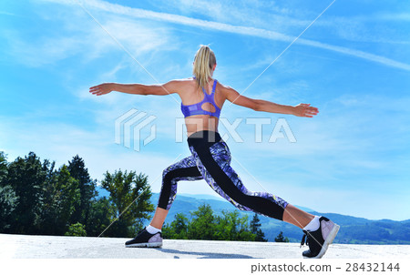 healthy young pretty woman stretching her leg 28432144
