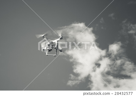 White quadrocopter, small drone in sky White quadrocopter, small drone in sky 28432577