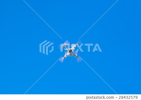 White drone controlled by wireless remote 28432579