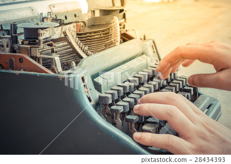 Typewriter and human hand 28434393