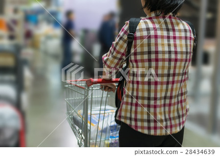 Woman and shopping cart 28434639