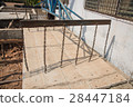 Worker placing cement floor in construction site 28447184