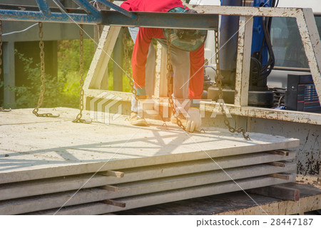 Worker placing cement floor in construction site 28447187