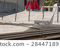 Worker placing cement floor in construction site 28447189