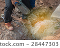 Worker drilling cement concrete floor with machine 28447303