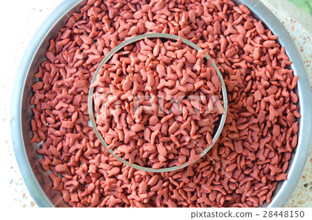 cat food in stainless bowl on weighing scale tray 28448150