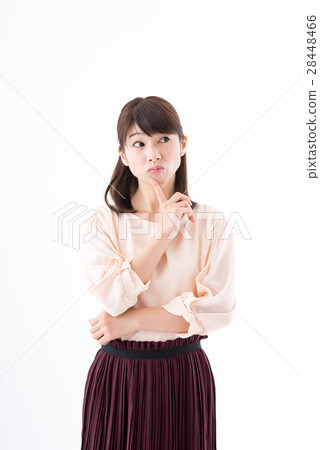 A young woman, office casual thinks A young woman, office casual thinks 28448466