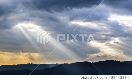 Sunset over beautiful blue sky with sun shining 28448584