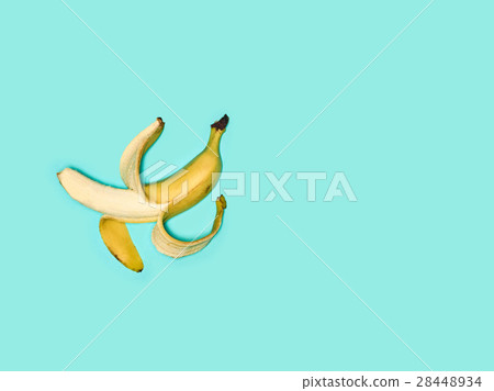 Single banana against blue background Single banana against blue background 28448934