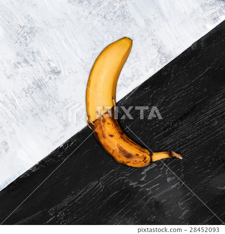 Single banana against blue background Single banana against blue background 28452093