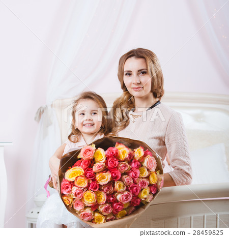 Smiling mother with daughter portrait 28459825