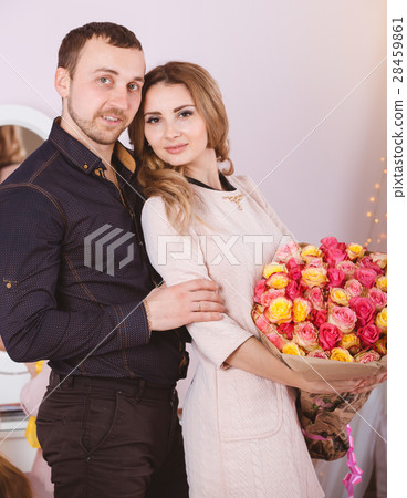 Young couple portrait with roses 28459861