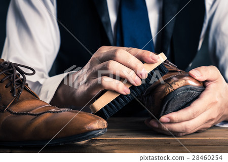 Men who take care of leather shoes 28460254