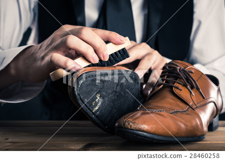 Men who take care of leather shoes Men who take care of leather shoes 28460258