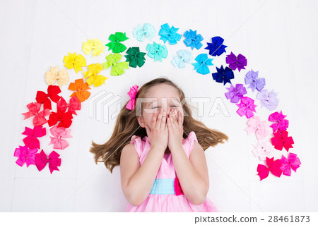 Little girl with colorful bow. Hair accessory 28461873