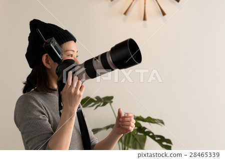 A woman taking a picture A woman taking a picture 28465339