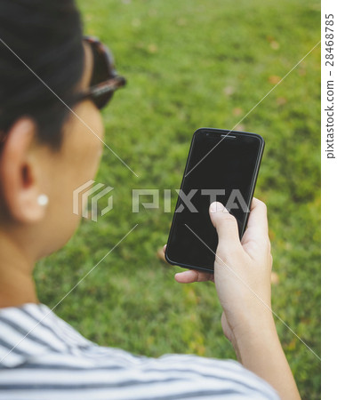 Woman Hand holding Mobile Smart phone outdoor Woman Hand holding Mobile Smart phone outdoor 28468785