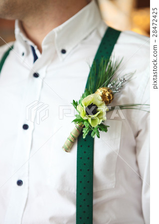 Groom wearing buttonhole 28472425