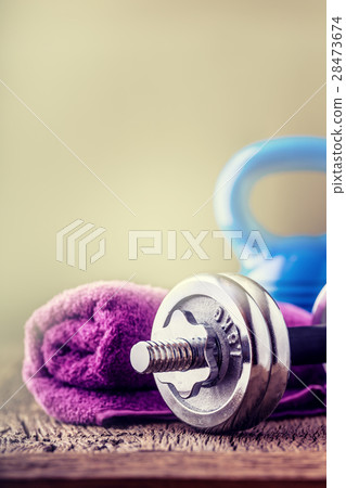 Kettlebell dumbbell towel water and measuring tape 28473674