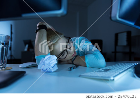 Sleepy programmer feeling exhausted in the office 28476125