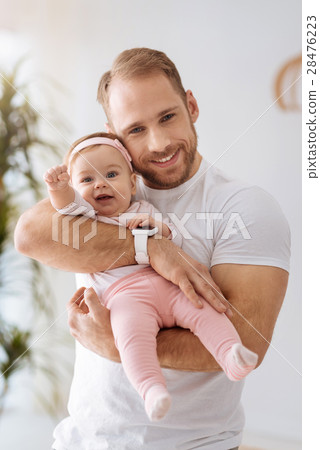 Amused kid girl having fun with her father Amused kid girl having fun with her father 28476223