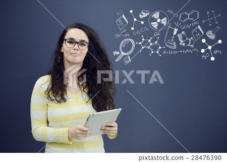 Woman with tablet in front of background with Woman with tablet in front of background with 28476390