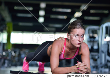 Shot of a fit young woman doing stretching workout Shot of a fit young woman doing stretching workout 28476476