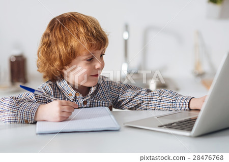 Hard working smart boy studying for his test Hard working smart boy studying for his test 28476768