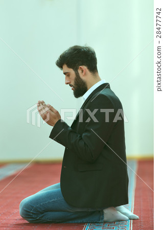 Young beautiful Muslim Man Praying In Mosque 28477742