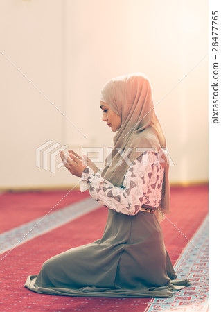 Young beautiful Muslim Woman Praying In Mosque 28477765