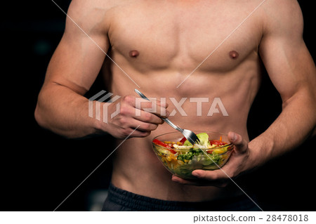 Shaped and healthy body building man holding a 28478018