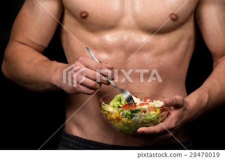 Shaped and healthy body building man holding a 28478019