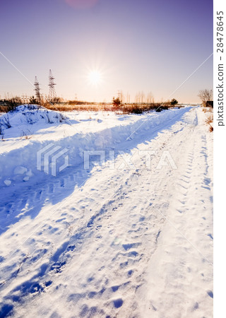 Rural road in winter at sunset 28478645