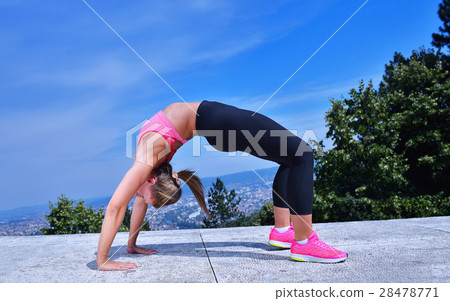 healthy young pretty woman stretching her leg 28478771