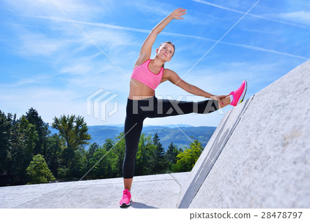 healthy young pretty woman stretching her leg 28478797